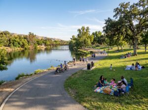 Families enjoying a picnic at The Park at River Walk near the Kern River